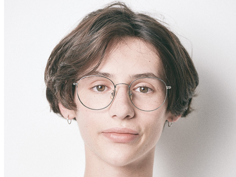 Person wearing NYBK G. Glen Cove M56 Silver Glasses