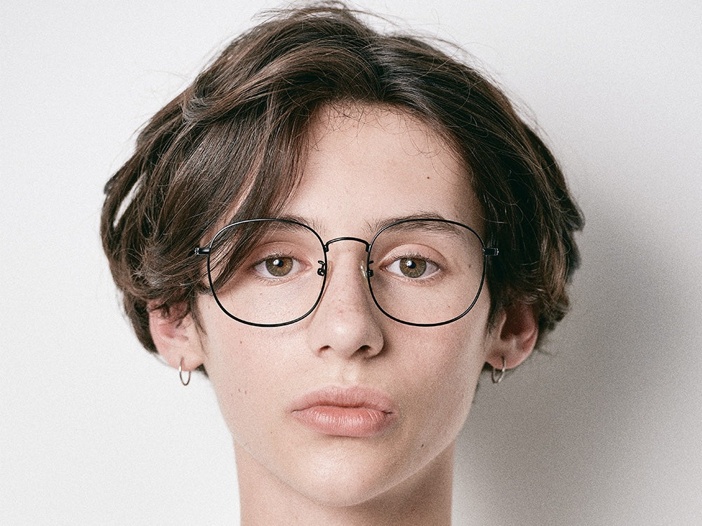 Person wearing NYBK G. Glens Falls M7 Black Glasses