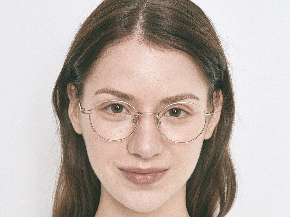 Person wearing NYBK Newburgh T32 Brushed Gold Glasses