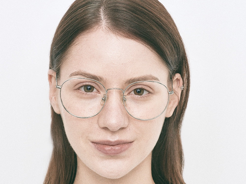 Person wearing NYBK G. Glen Cove M56 Silver Glasses