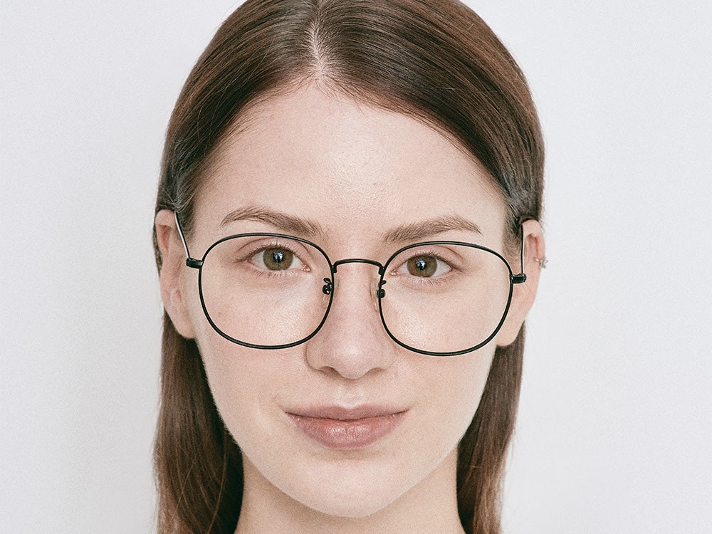 Person wearing NYBK G. Glens Falls M7 Black Glasses