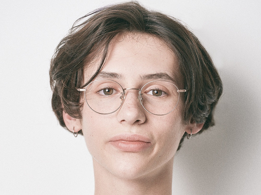 Person wearing NYBK Newburgh T32 Brushed Gold Glasses